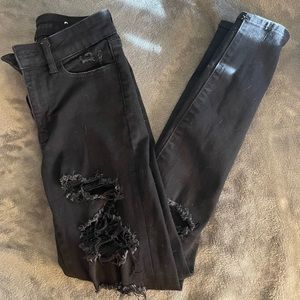 American Eagle black jeans, ripped style. Size 4. Cotton/poly+ blend.